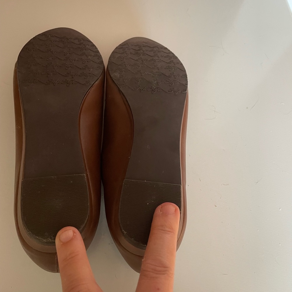 Brown slip on flats.